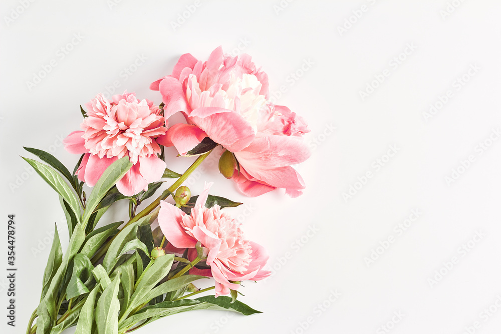 wedding concept. bouquet of peonies close-up on a white background. the layout of the summer Invitational. flat lay, top view