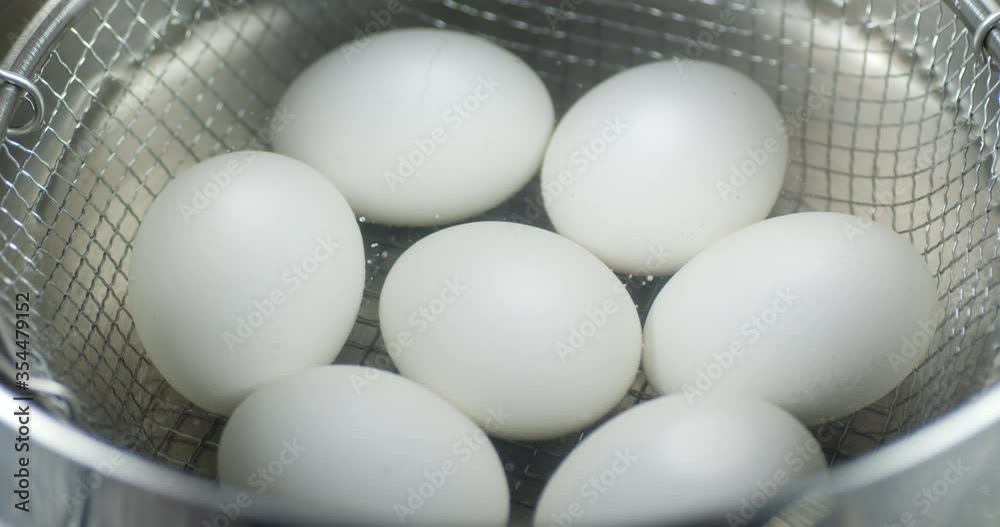 Boiled eggs in a colander with hot steam. Boiled eggs in a colander with hot steam.