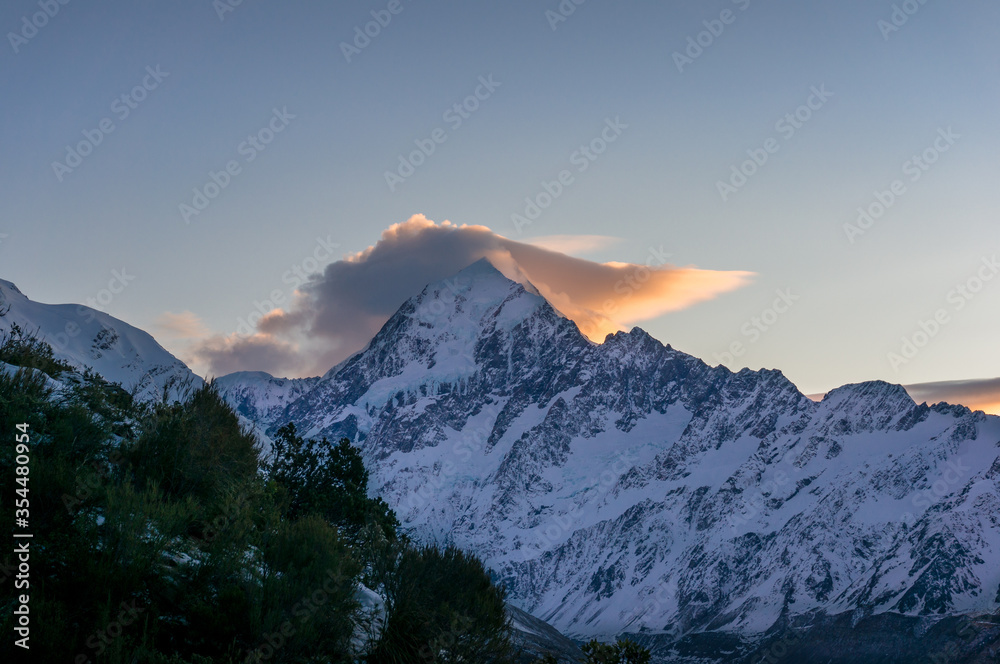 Winter mountain landscape on sunset with snow covered mountains