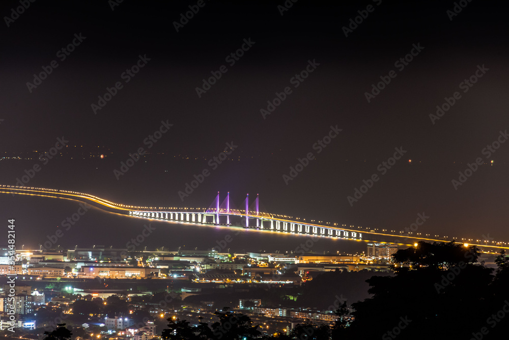 Fototapeta premium Aerial view of 2nd Penang Bridge view during light up from Balik Pulau Hill
