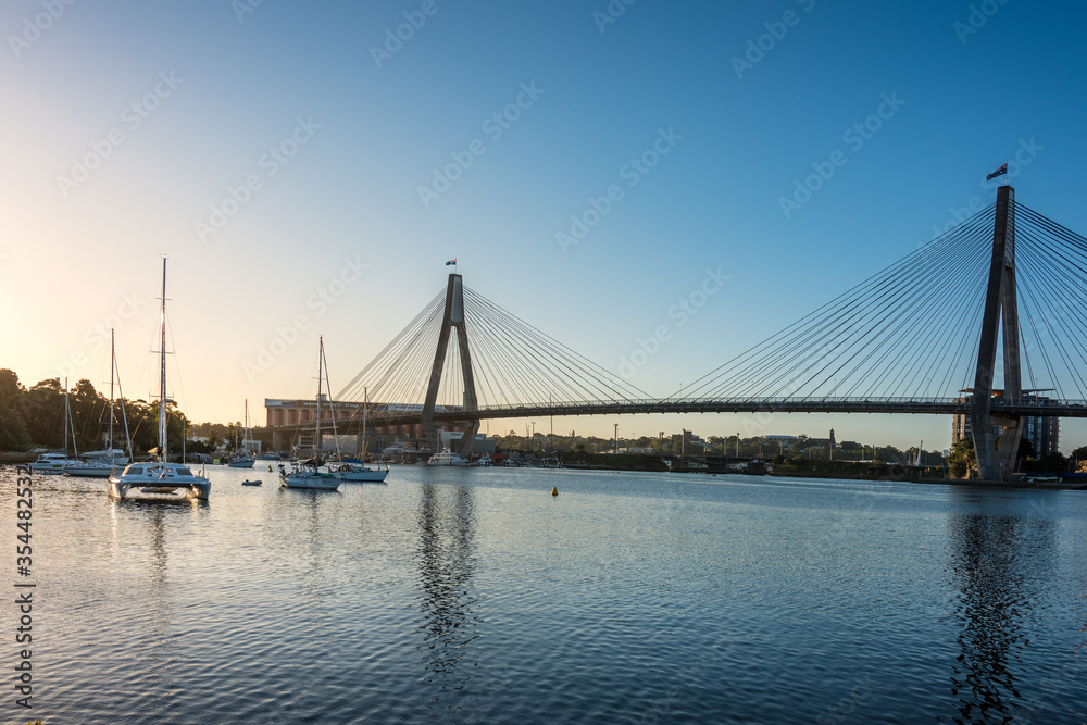 Naklejka premium Sydney cityscape with harbor view, ANZAC bridge and boats