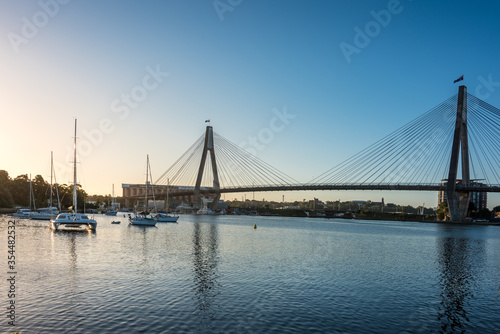 Sydney cityscape with harbor view, ANZAC bridge and boats