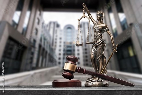 Photos Sculpture justice bronze lady and open books and gavel