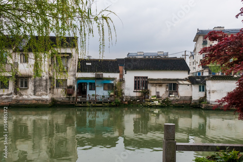 Blue house on canal, Suzhou, China photo