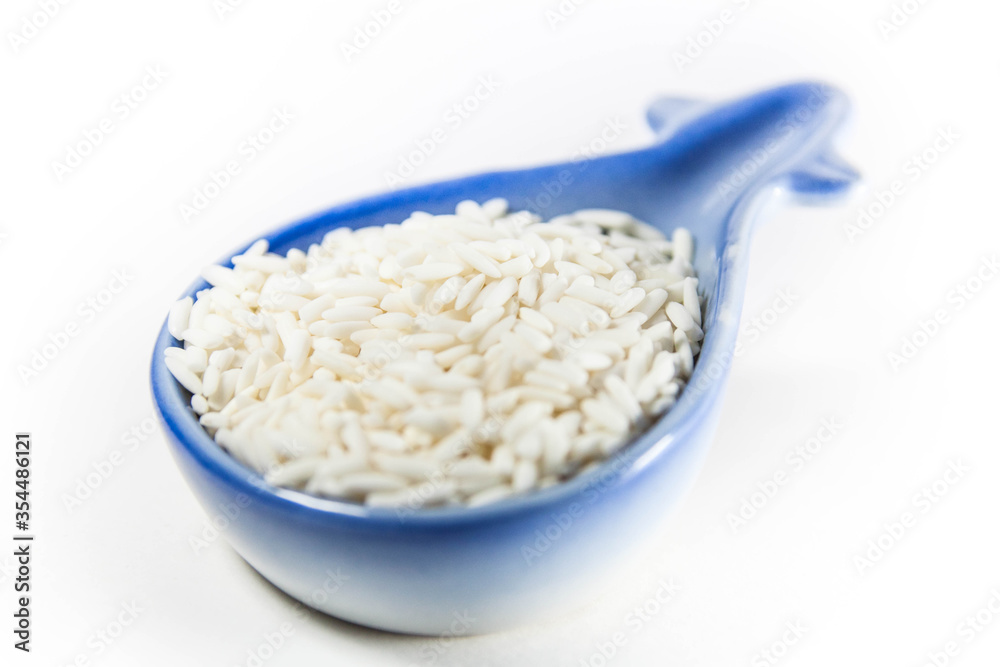 Raw glutinous sticky rice in a white isolated background Raw glutinous sticky rice in a white isolated background