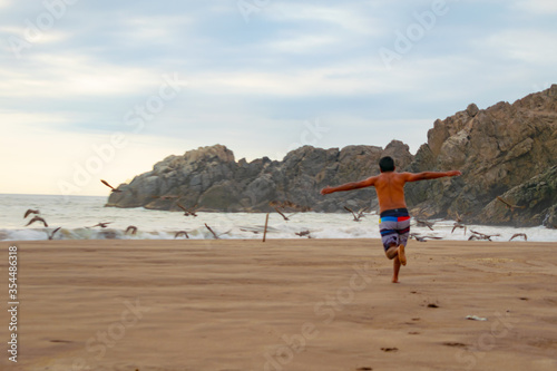 man running on the beach