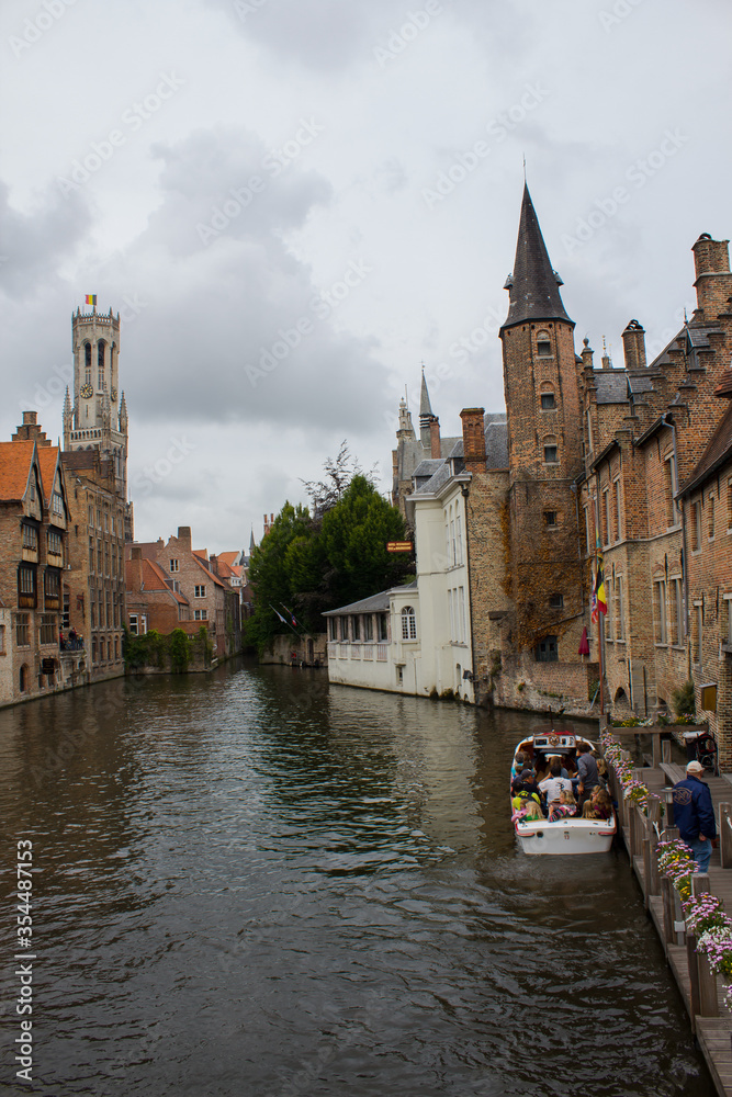 Sightseeing boat tour canal in Bruges. West Flanders province Belgium 