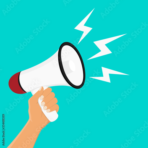 Hand holding megaphone on blue background. Digital marketing, social media marketing concept.