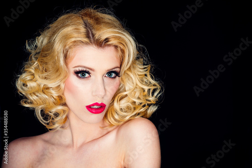 Portrait of beautiful young sexy woman with vintage make-up and hairstyle. Pin-up girl. American style.