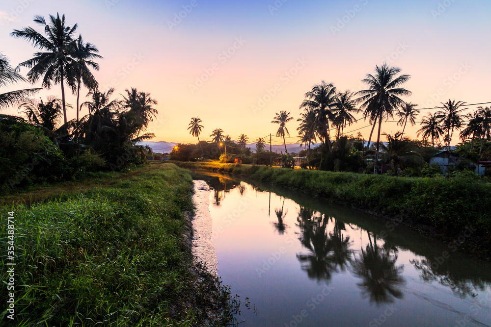 Village river reflection of sunrise view in Balik Pulau, Penang