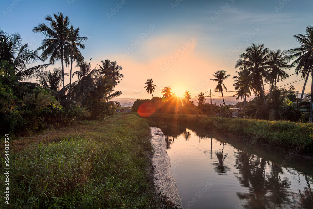 Village river reflection of sunrise view in Balik Pulau, Penang
