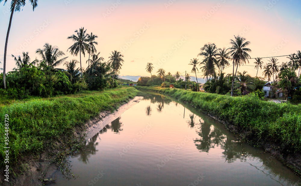 Village river reflection of sunrise view in Balik Pulau, Penang