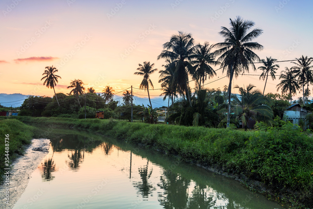 Village river reflection of sunrise view in Balik Pulau, Penang