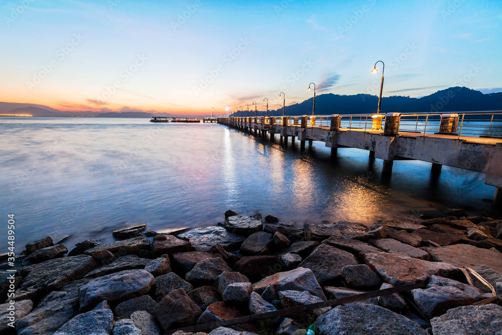 Jerejak Pier view during sunrise by the shore of Bayan Mutiara