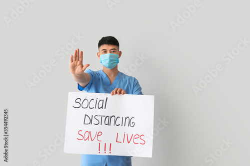 Young doctor holding paper ...