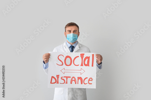 Young doctor holding paper ...