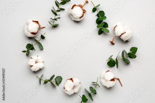 Composition with beautiful cotton flowers on light background