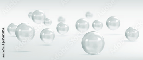 Vector spheres and balls on a grey background with a shadow.