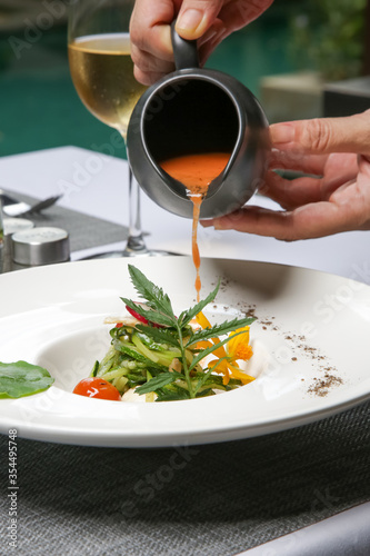 Healthy organic tomato soup. Modern creative restaurant meal. Exquisite dish  haute couture food.