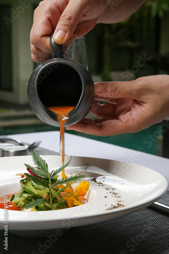 Fototapeta Naklejka Na Ścianę i Meble -  Healthy organic tomato soup. Modern creative restaurant meal. Exquisite dish, haute couture food.