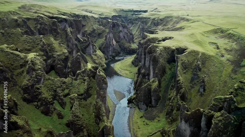 Unique rugged landscape of Fjadrargljufur canyon covered by beautiful green moss, located in southern Iceland. Aerial shot. photo