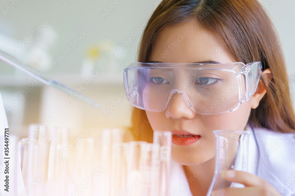 Doctor and microbiologist with vacuum tubes for samples with COVID 19 infection atypical pneumonia virus in laboratory Doctor and microbiologist with vacuum tubes for samples with COVID 19 infection atypical pneumonia virus in laboratory