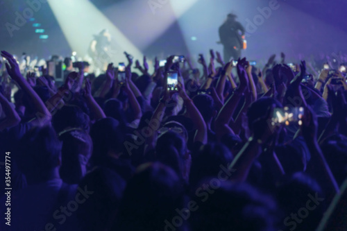 blur of People shooting video or photo in music brand showing on stage or Concert Live  party concept
