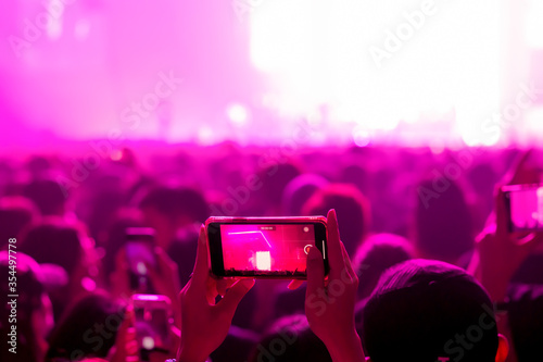 People shooting video or photo in music brand showing on stage or Concert Live, party concept