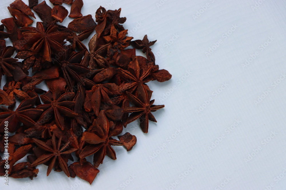 Star anise spice fruits and seeds isolated on white background closeup
Star anise spice fruits and seeds isolated on white background closeup
