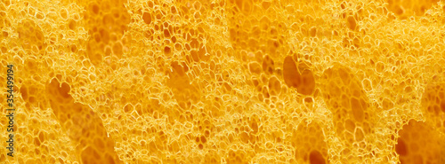 banner of macro yellow polyurethane foam rubber washcloth sponge photo