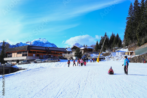Obraz na płótnie Alleghe, Italy, 01/20/2020 , Ski area at Piani di Pezzè, 1470 meters above sea level, gives immediate access to the ski Civetta area and is the ideal starting point to explore the Civetta massif