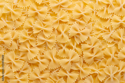 Raw farfalle Italian macaroni pasta. Top view.