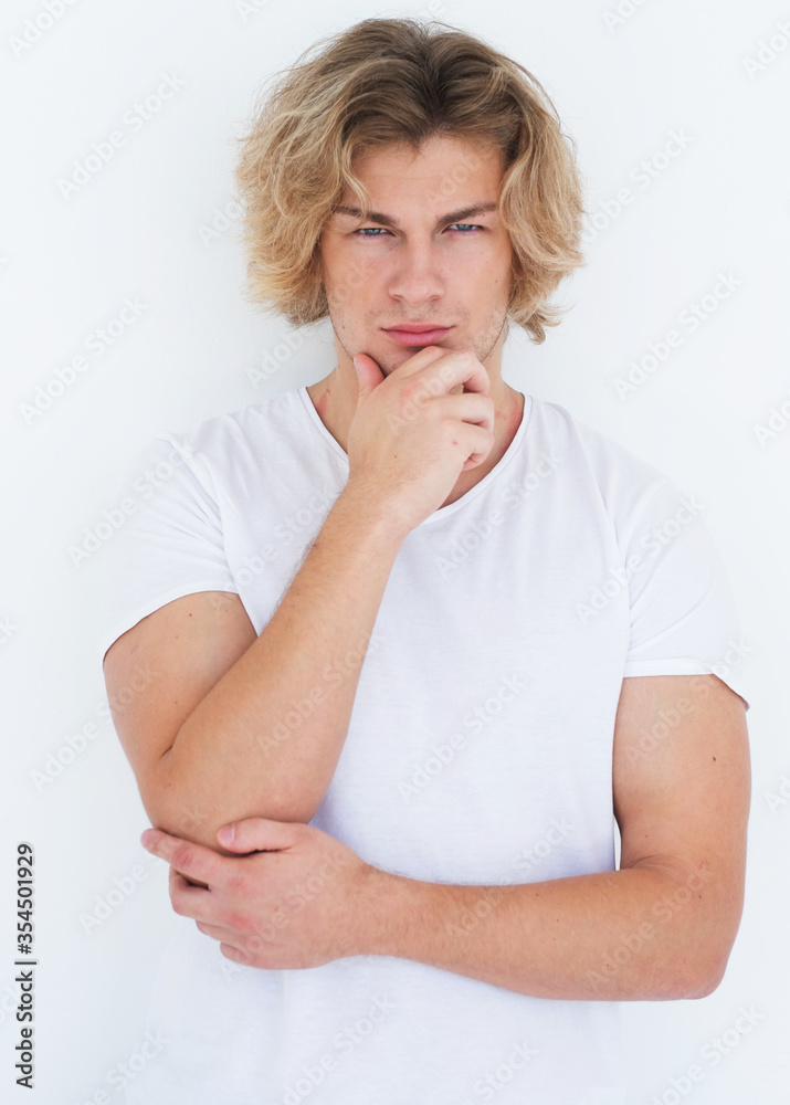 Young handsome male posing in studio, fashion style Young handsome male posing in studio, fashion style