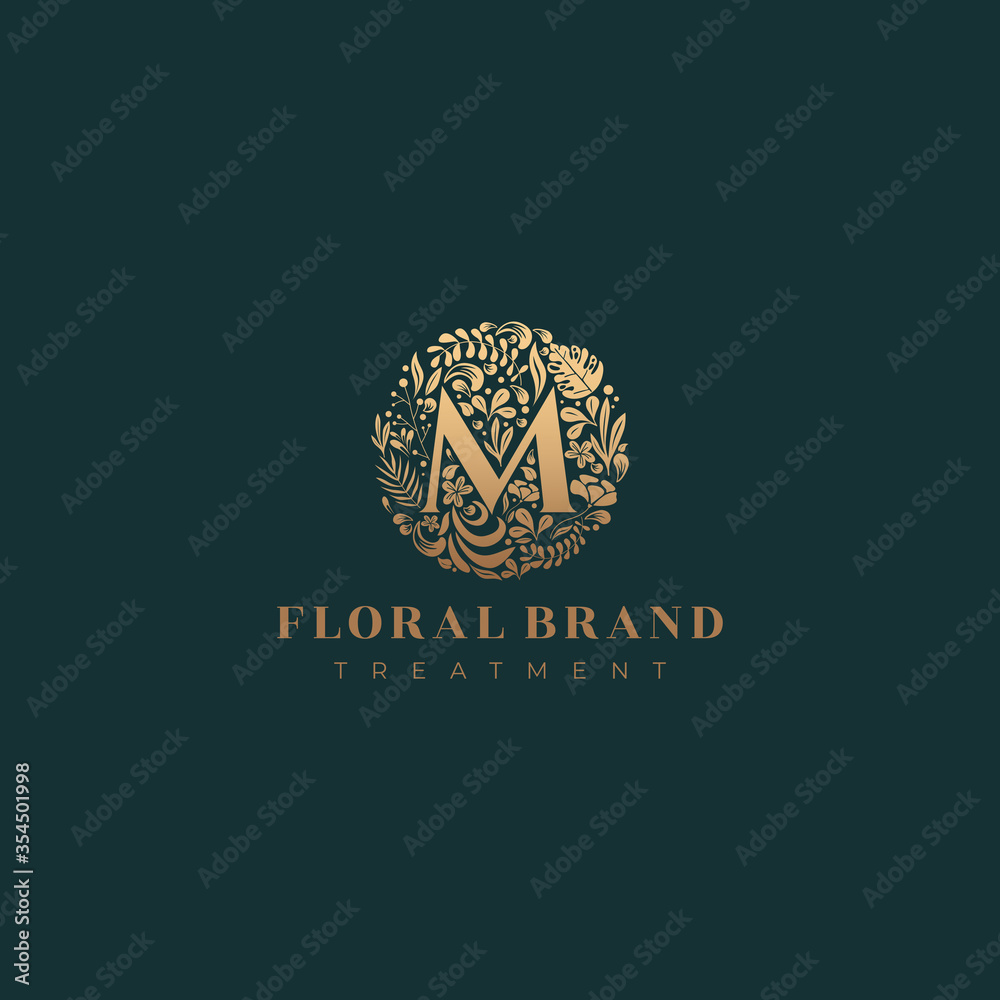 Letter M golden luxurious circle floral decorative logo