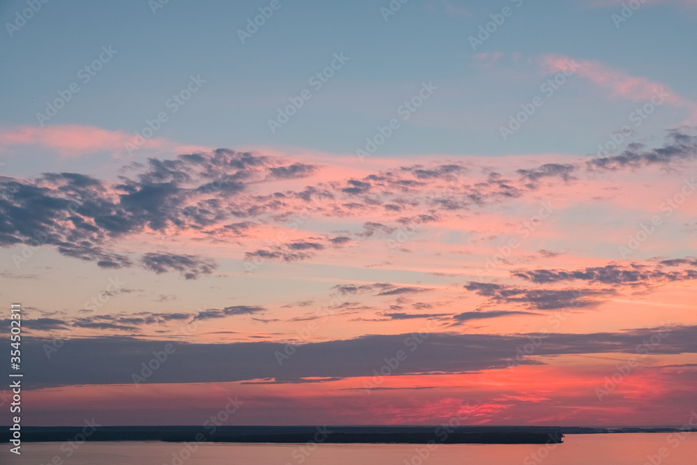 Beautiful sunrise sky with clouds and early sun. Structure and texture. Sunset. Nature landscape at the morning. Meditation and relaxation. Abstract background and horizon.
