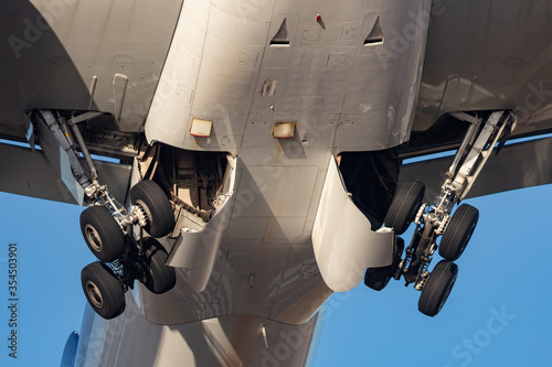 Landing gear retracting on a large commercial airplane after takeoff.