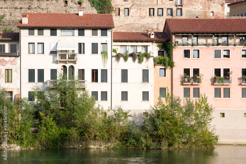 Bassano del Grappa, Italy, 10/22/2019 , view of the buildings on the east side of brenta river in Bassano del grappa.