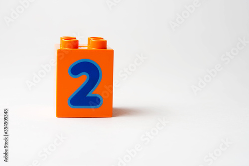 the number two written on the block from the children's constructor