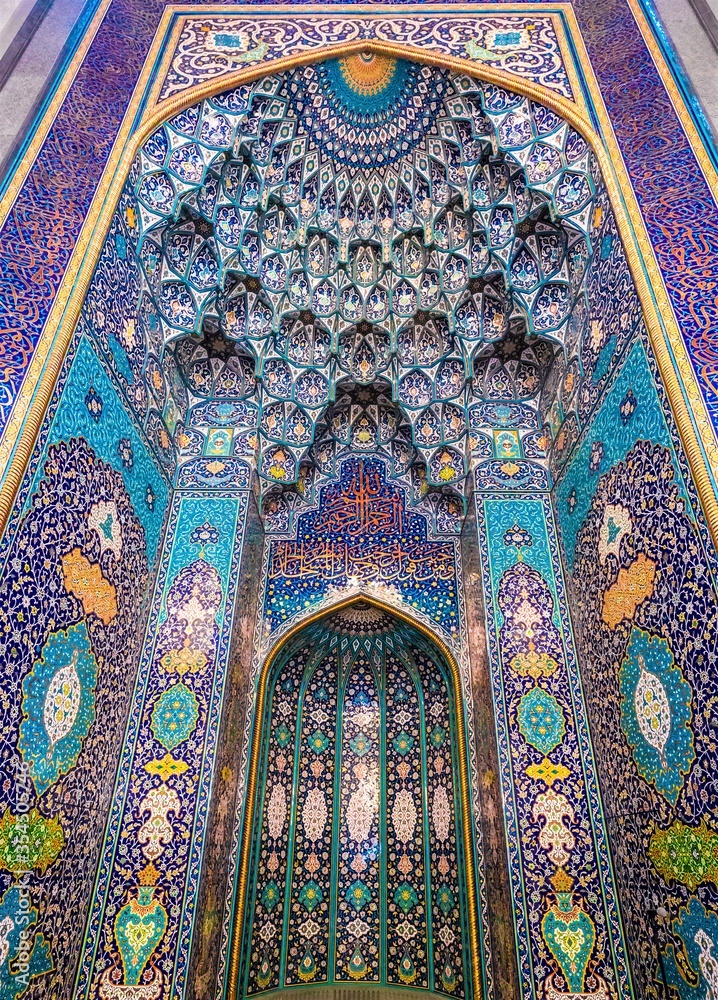 Interior of the mosque, colorful backgrounds depicting holy scriptures