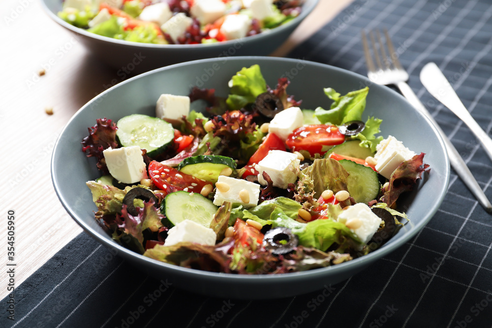 Tasty greek salad with fresh vegetables in a plate. Tasty greek salad with fresh vegetables in a plate.
