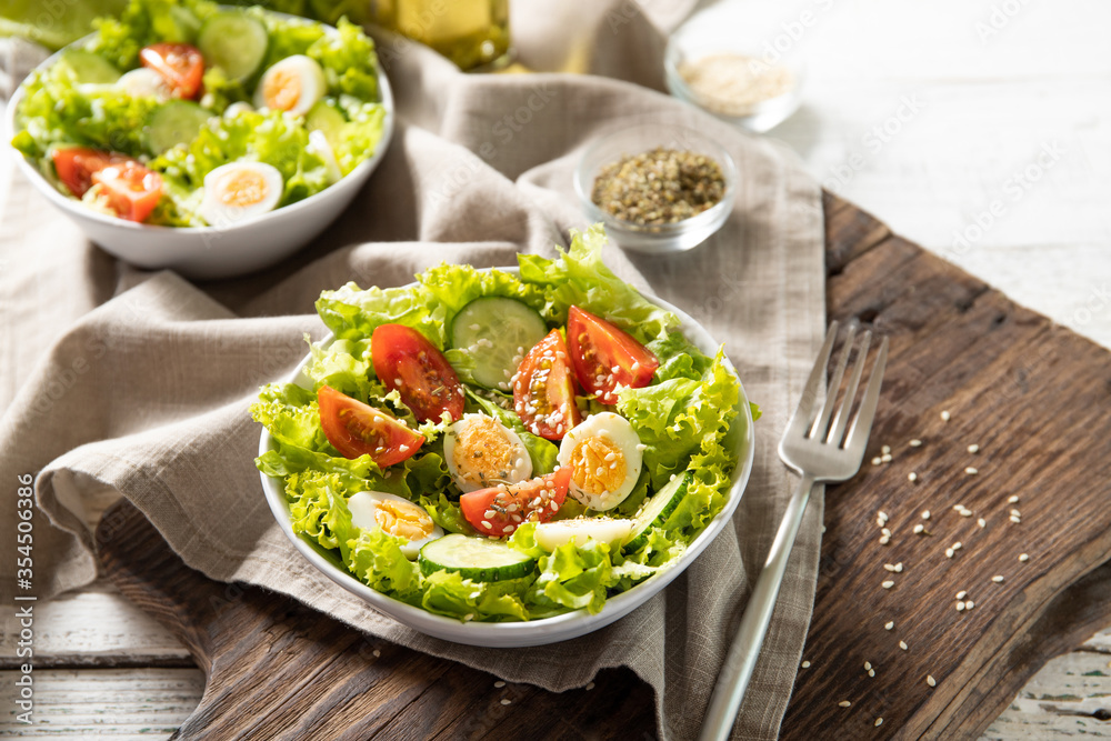 Tasty salad of fresh vegetables with quail eggs. Diet concept Tasty salad of fresh vegetables with quail eggs. Diet concept