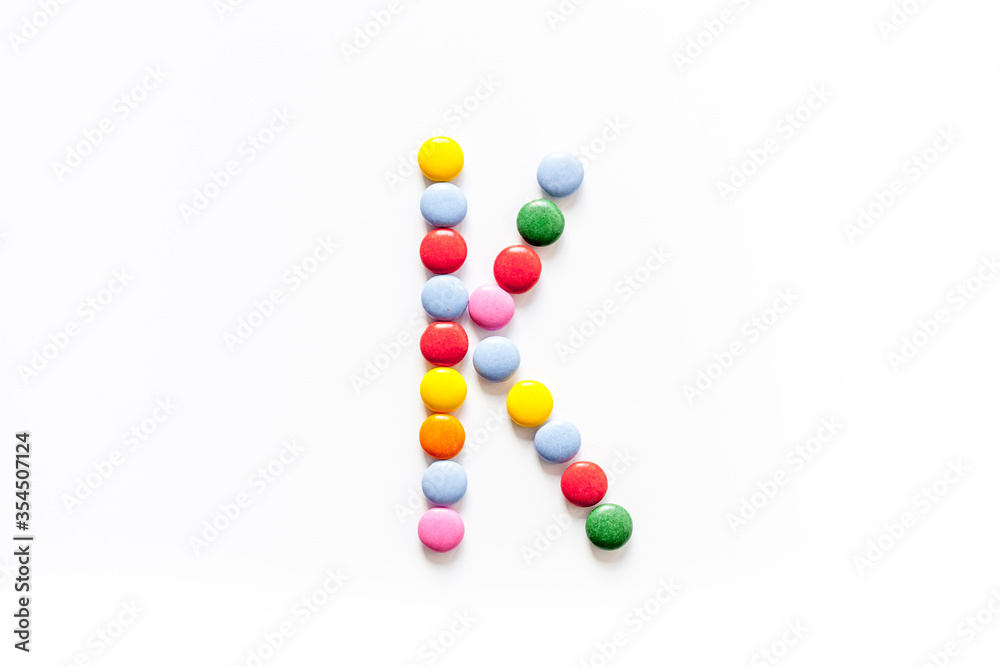 Candies font alphabet. Letter K isolated top view Candies font alphabet. Letter K isolated top view