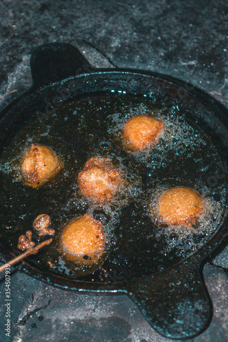 Kerala special food Unniyappam being cooked photo