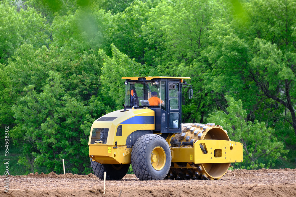 Soil Skating Rink, Road Roller Making New Highway. Heavy Industrial Machine Working on Construction New Road Soil Skating Rink, Road Roller Making New Highway. Heavy Industrial Machine Working on Construction New Road