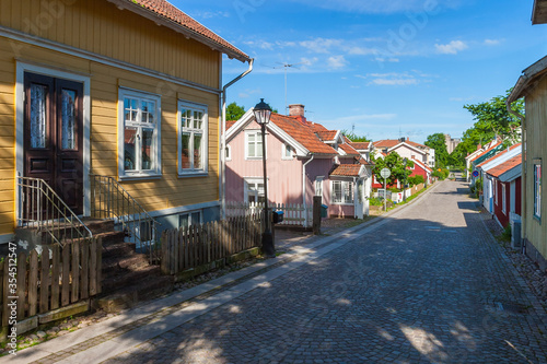 City street with old beautiful wooden houses