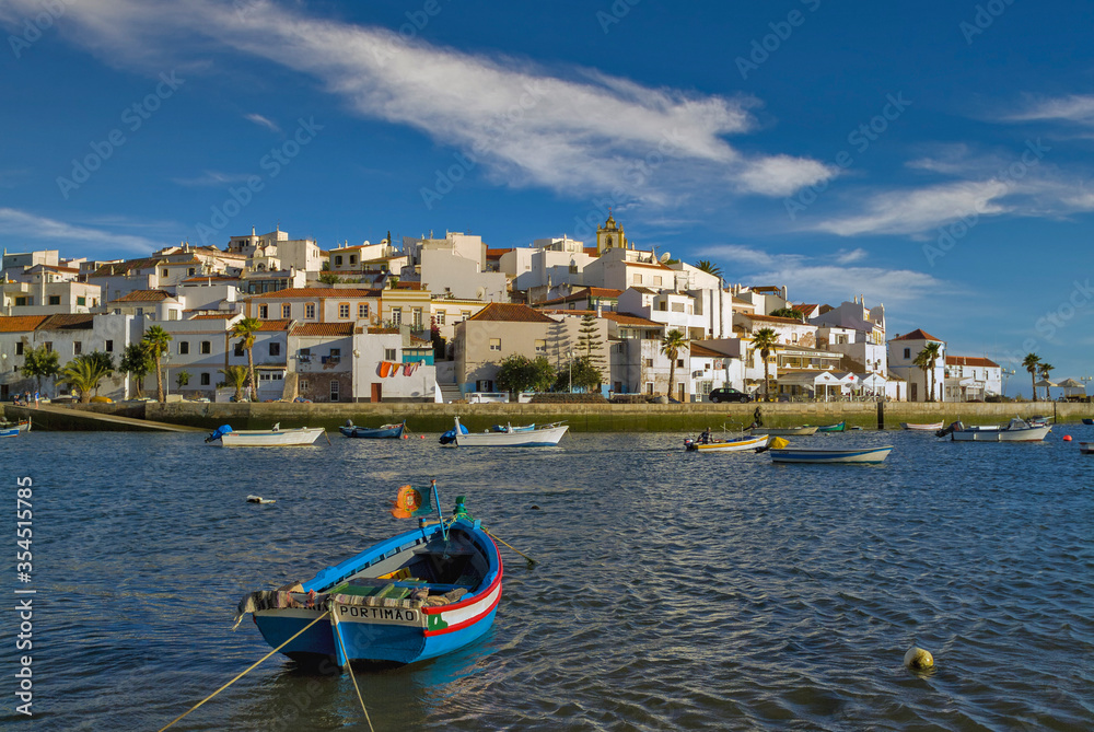 boats in the harbour of white village of Ferragudo in the Algarve