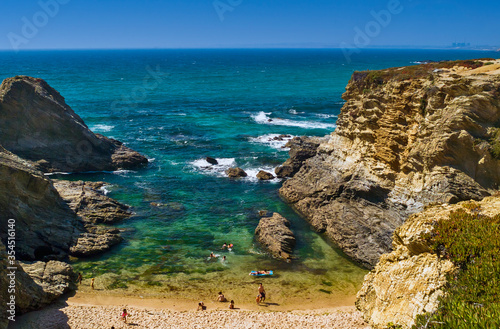 sand and rocks on the Grande Beach Porto Covo, Portugal photo