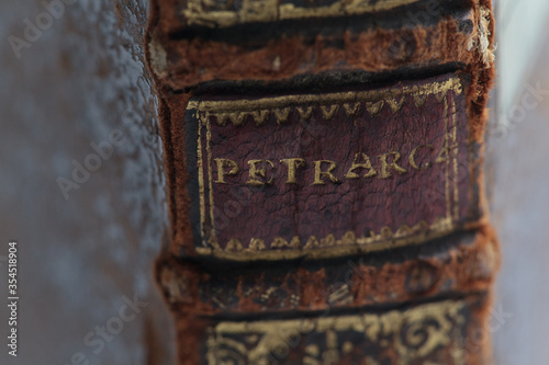 Il Petrarca, old leather book spine. closeup spine detail. photo