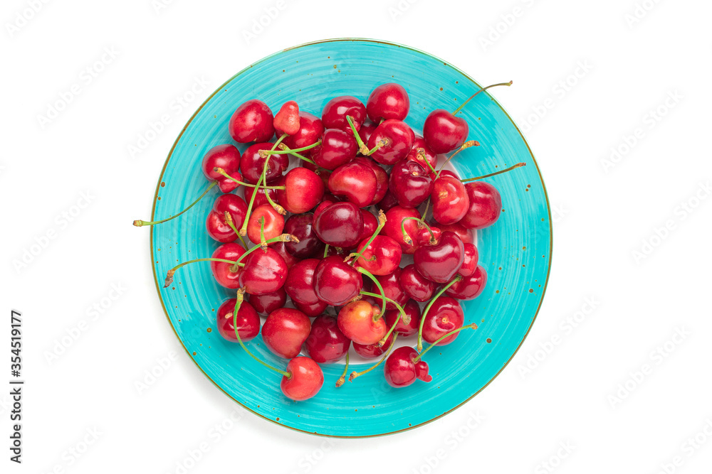 sweet organic berries in blue plate isolated on white background Top view Flat lay Summer harvest concept sweet organic berries in blue plate isolated on white background Top view Flat lay Summer harvest concept