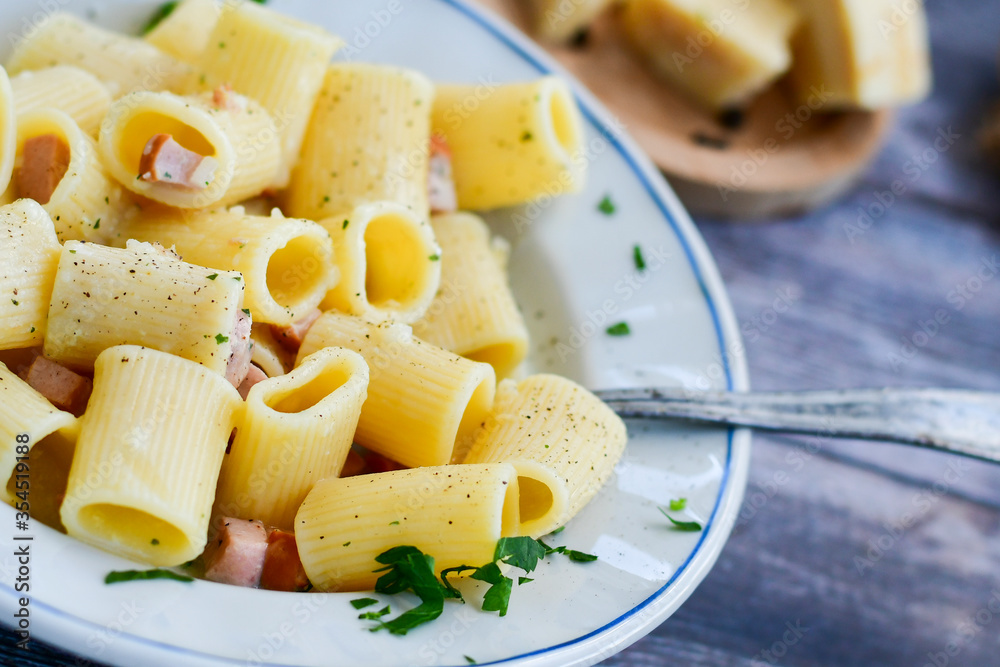 Fresh pasta rigatoni alla carbonara with cream sauce , egg, parmesan cheese ,olive oil and black pepper) Fresh pasta rigatoni alla carbonara with cream sauce , egg, parmesan cheese ,olive oil and black pepper)